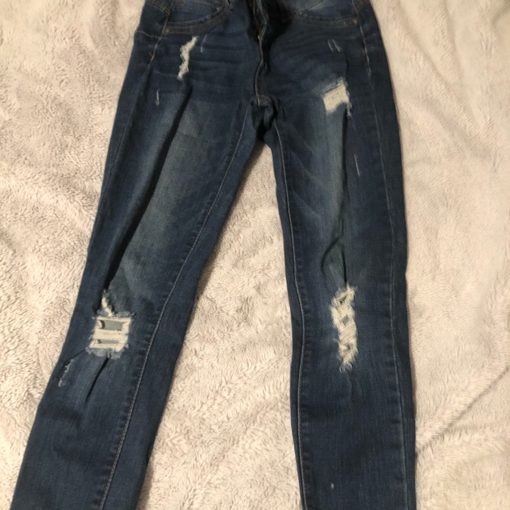 Ripped blue jeans